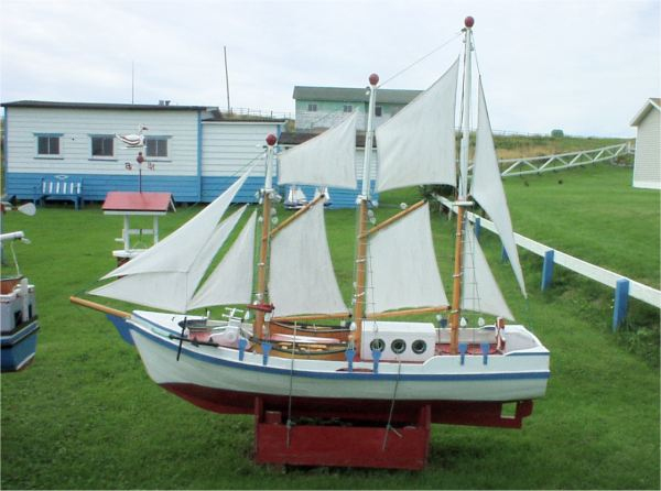 675: A model boat on Lawrence Barry's front lawn in St. Bride's. (2004)